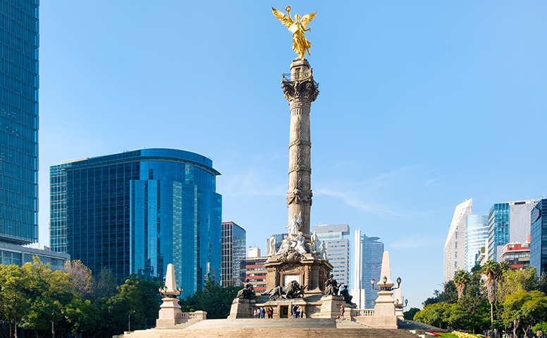 Mexico: Photograph of the "Monumenta a la Independencia", a large marble column with a golden angel at the top in the heart of Mexico City Mexico: Photograph of the "Monumenta a la Independencia", a large marble column with a golden angel at the top in the heart of Mexico City