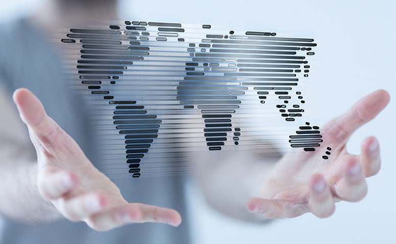 Stylised world map seen over two hands Stylised world map seen over two hands